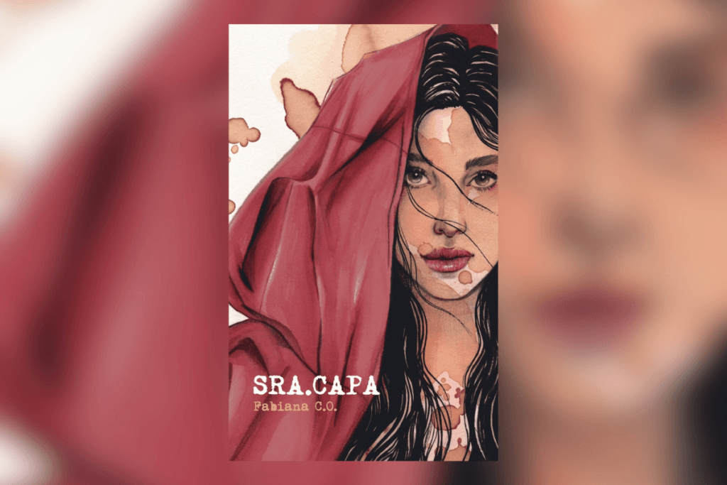 Capa de livro com a imagem de uma mulher usando uma capa vermelha e o título e nome da autora