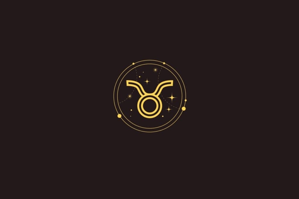 Ícone dourado do signo de Touro com um círculo e chifres curvados, cercado por um círculo com detalhes de estrelas sobre fundo preto