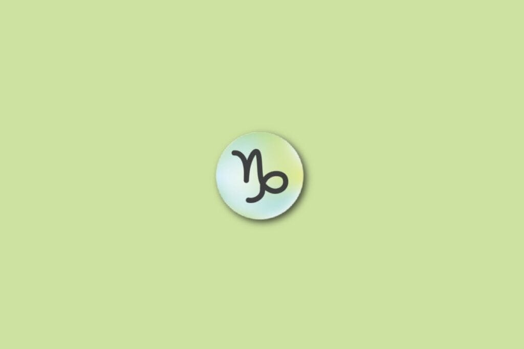 Ilustração do signo de capricórnio, em um círculo com as cores verde, azul e amarelo, sobre um fundo verde