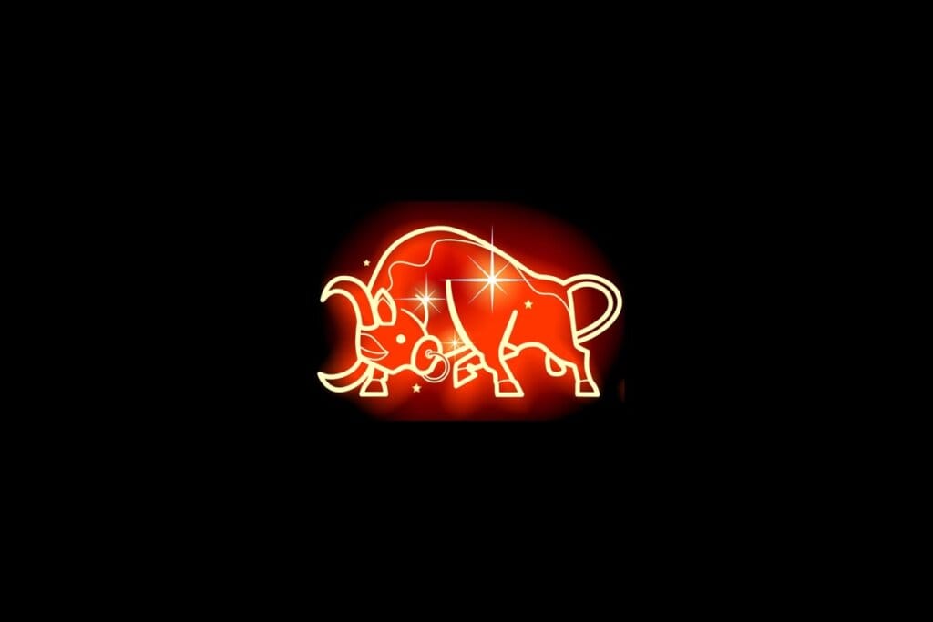 Ilustração em vermelho neon do signo de Touro em fundo preto