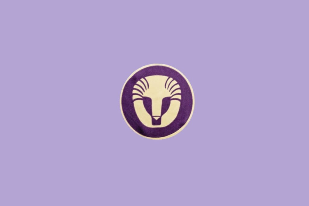 Ilustração minimalista do signo de Leão, com um leão estilizado em círculo roxo