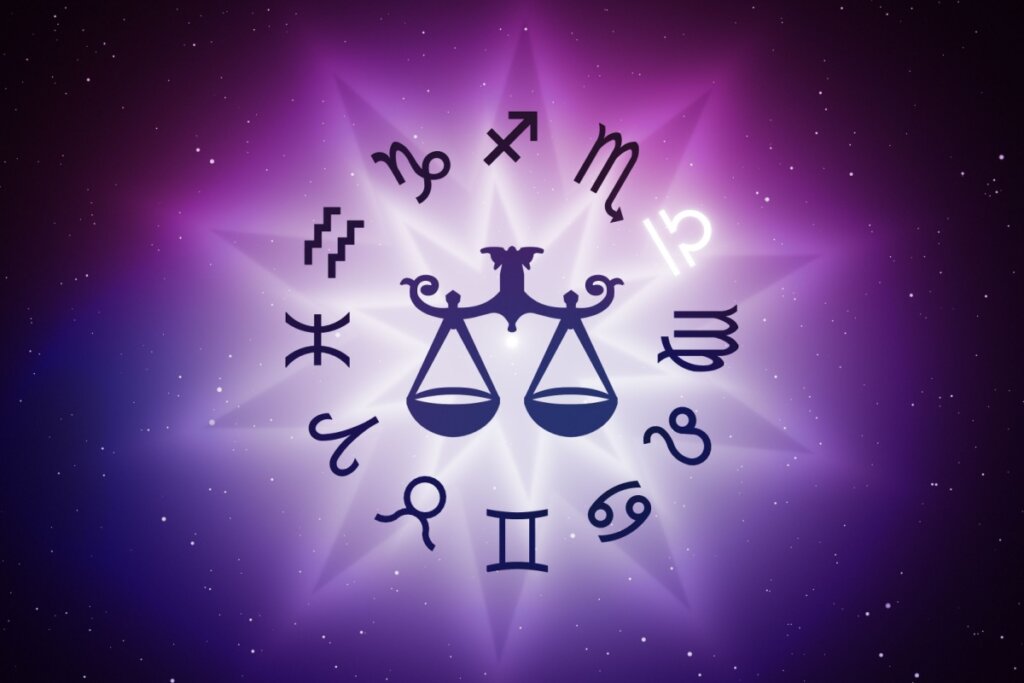Símbolo do signo de Libra com um círculo no fundo com os símbolos dos outros signos em fundo roxo com ponto de luz no centro