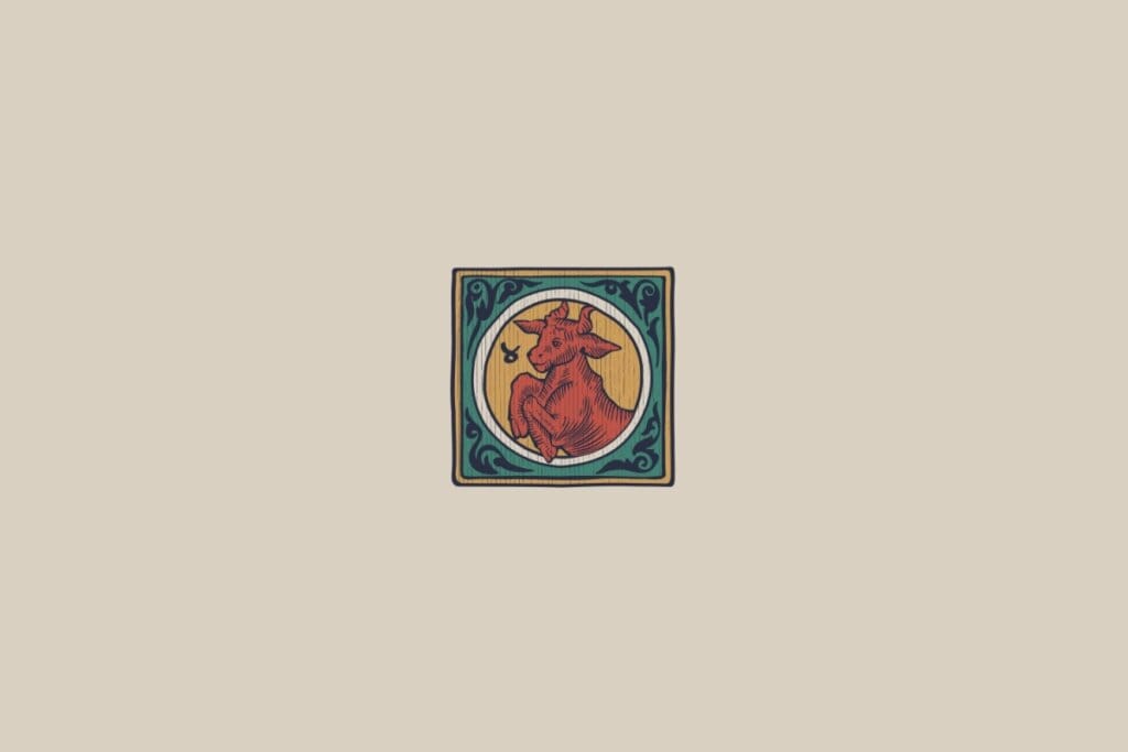 Ilustração medieval estilizada do signo de Touro, mostrando um touro, emoldurado por elementos decorativos