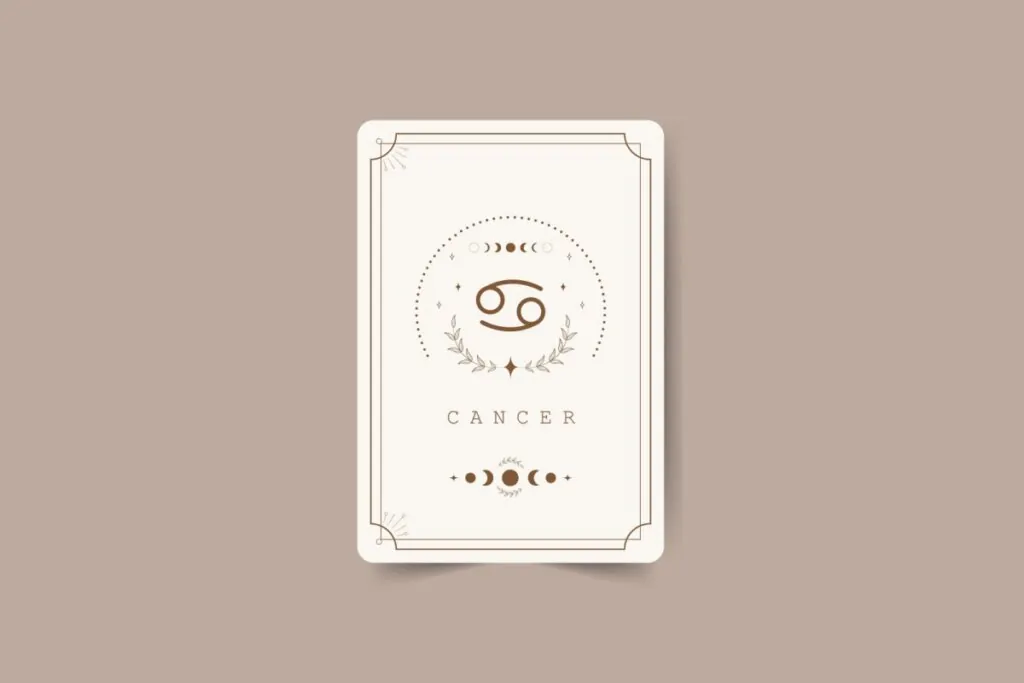 ilustração de uma carta branca com símbolo do signo de câncer marrom com pontos em volta, nome do signo em inglês embaixo e desenhos de lua. carta está em fundo marrom-claro