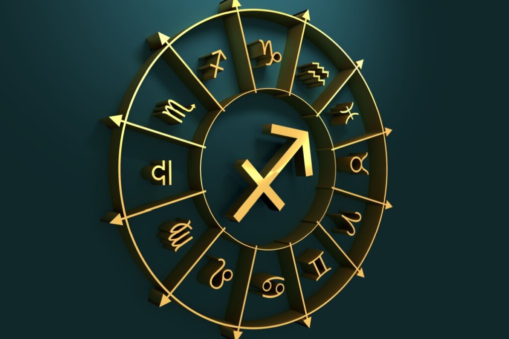 círculo em amarelo com símbolo dos 12 signos em volta, separados por flechas, com símbolo do signo de sagitário no centro, sobre fundo verde-escuro