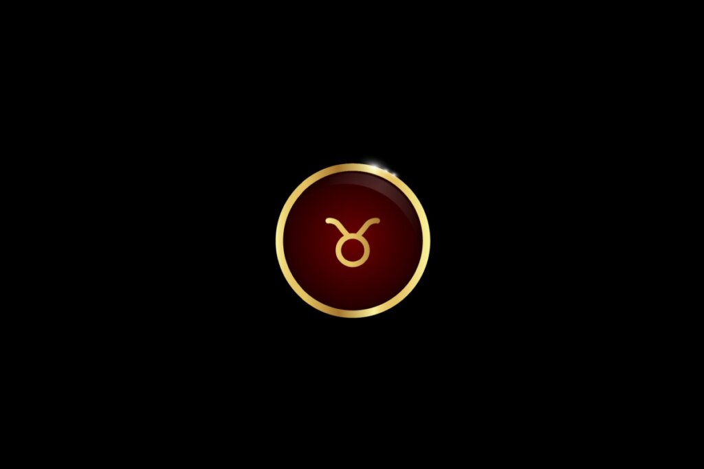 Ilustração do signo de touro dentro de um círculo dourado, iluminado com uma luz vermelha, em um fundo preto