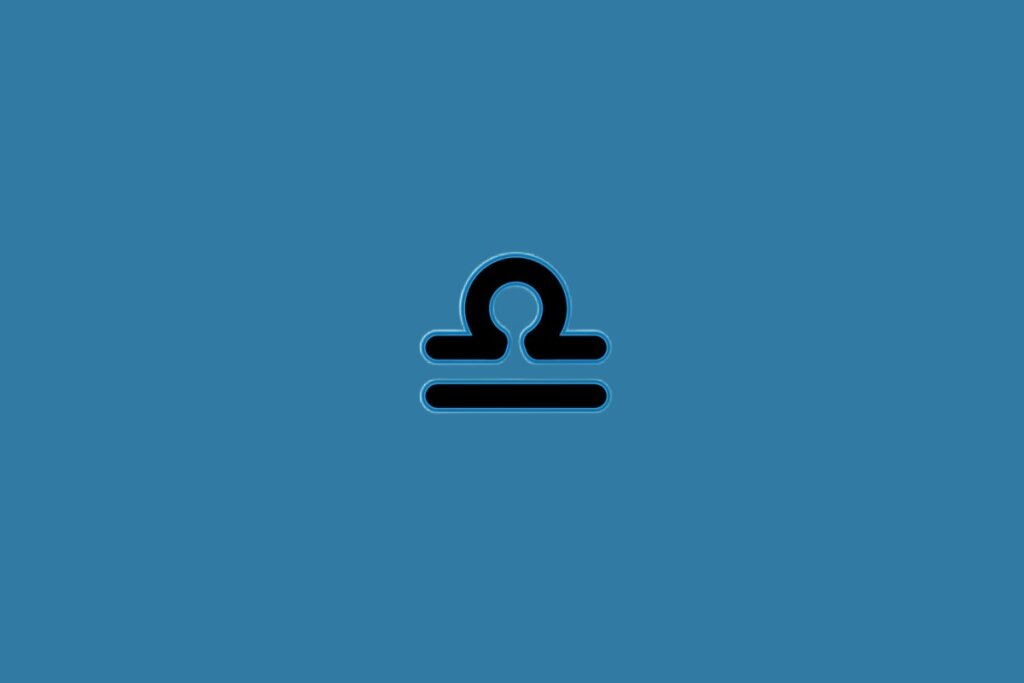 Ilustração do signo de libra na cor preta sobre um fundo azul