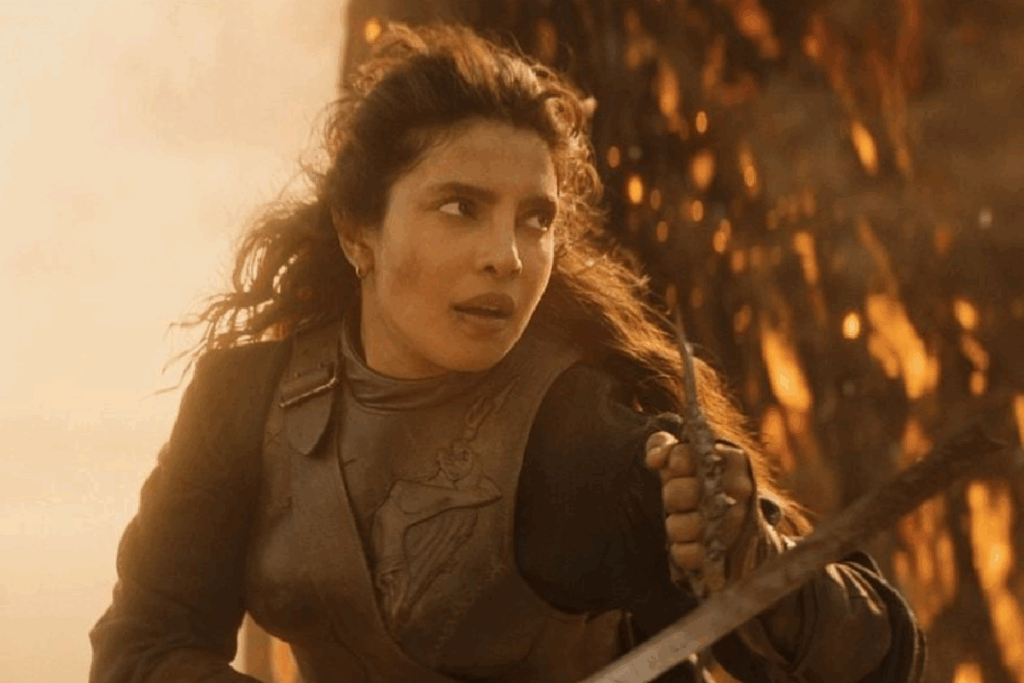 Personagem de Priyanka Chopra Jonas empunhando uma arma durante confronto em cena do filme O Refúgio