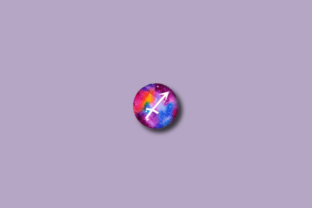 Ilustração do signo de sagitário em um círculo colorido e sobre um fundo lilás