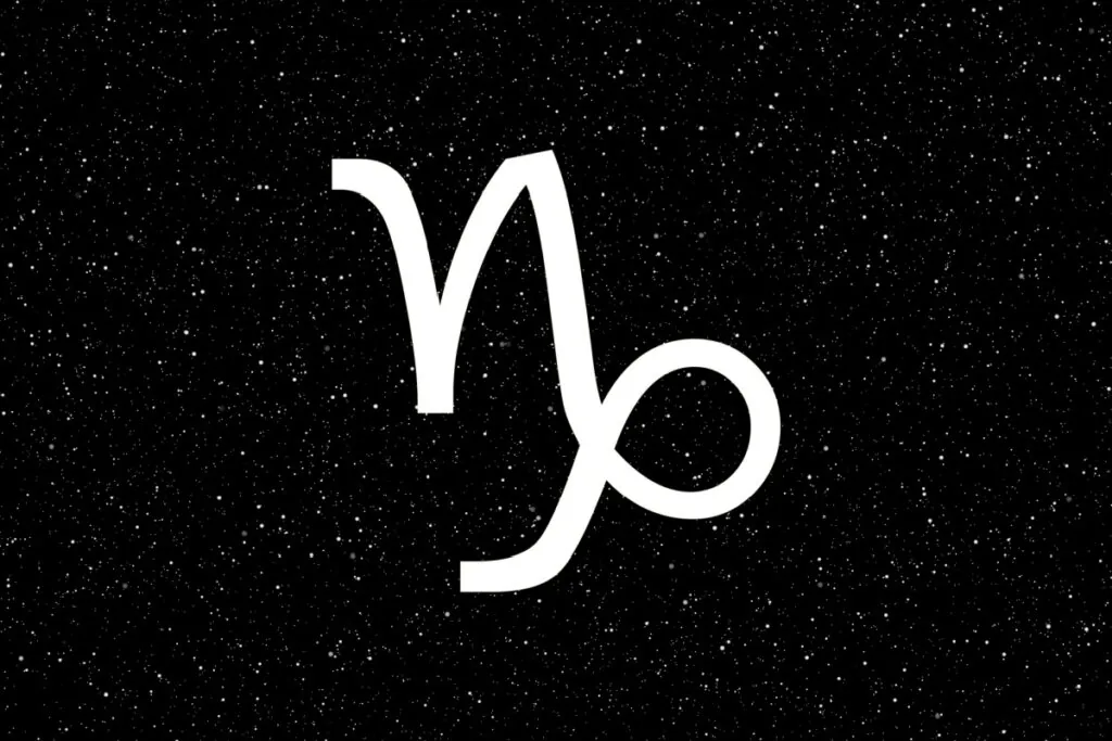 Símbolo de Capricórnio com textura de galáxia azul e efeito de vidro, com linhas que formam um "V" curvado, sobre um fundo de céu noturno azul-escuro profundo e estrelado.