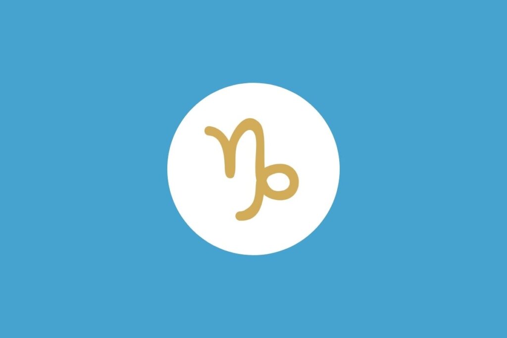 Símbolo do signo de Capricórnio em um círculo branco sobre fundo azul