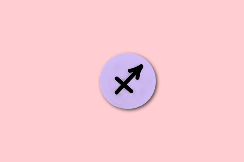 círculo lilás com ilustração preta do símbolo do signo de sagitário sobre fundo rosa