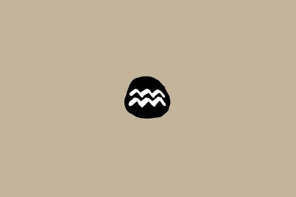Símbolo do signo de Aquário em branco dentro de um círculo preto sobre um fundo bege