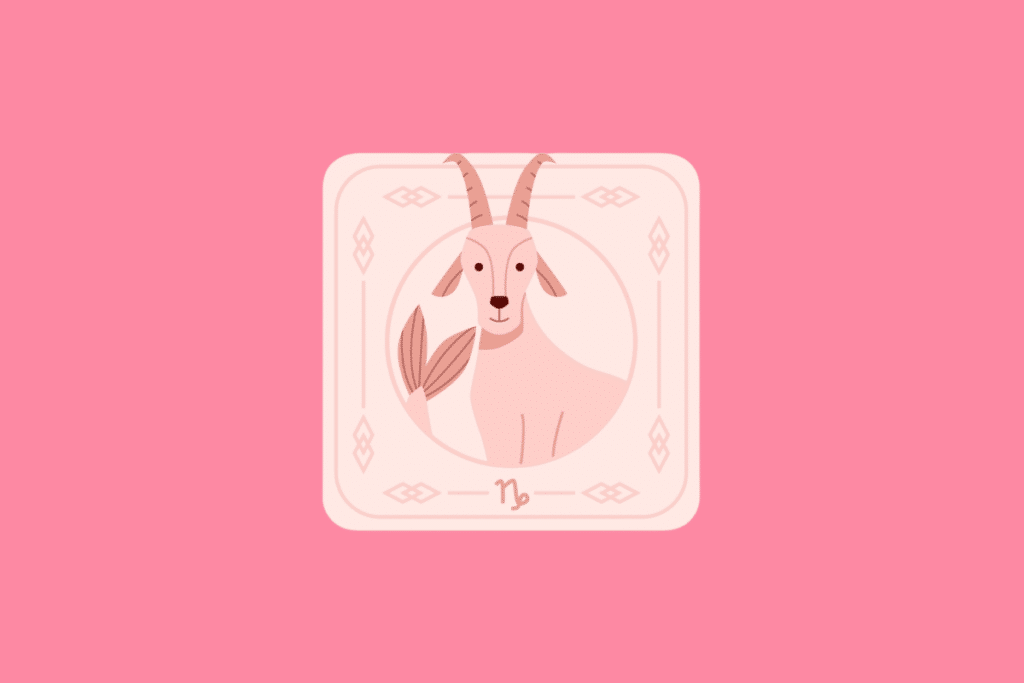 Ilustração estilizada de uma carta com fundo rosa pastel. No centro, dentro de uma moldura circular, há a figura de uma cabra com cauda de peixe. Na parte inferior da carta, encontra-se o símbolo do signo de Capricórnio.