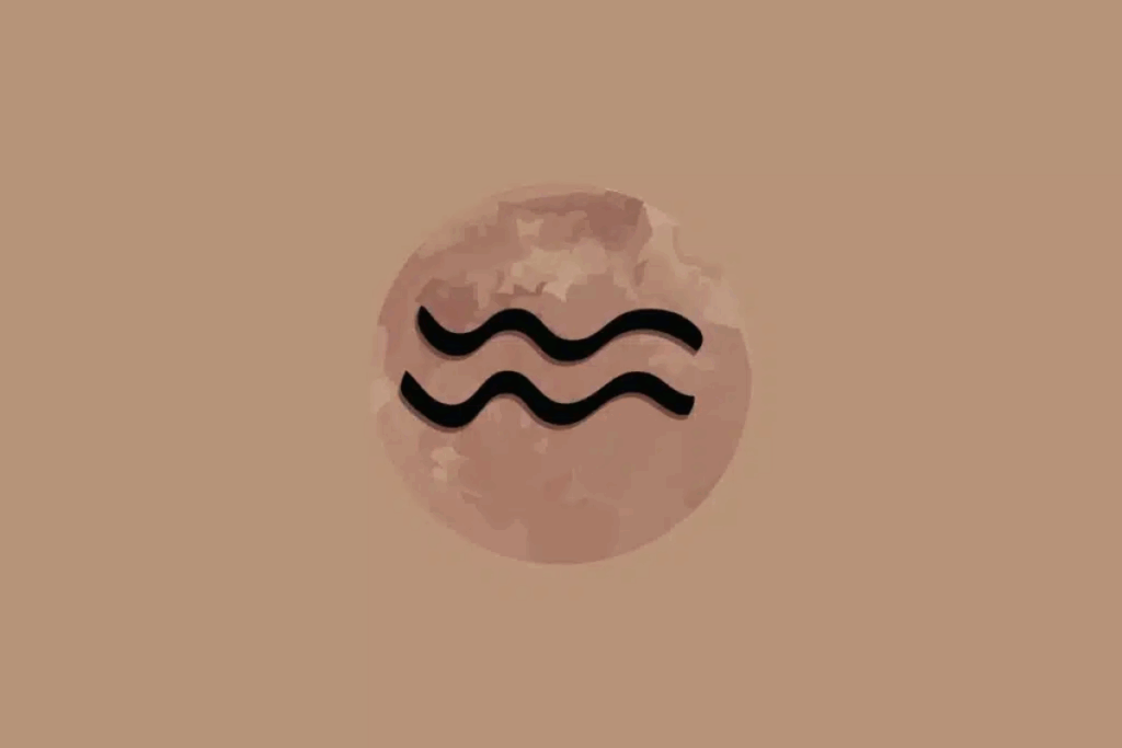 Imagem com fundo bege, apresentando um círculo em tom rosado no centro, com textura que lembra a superfície da Lua. Dentro dele, aparece o símbolo astrológico do signo de Aquário em preto, formado por duas linhas onduladas e paralelas.